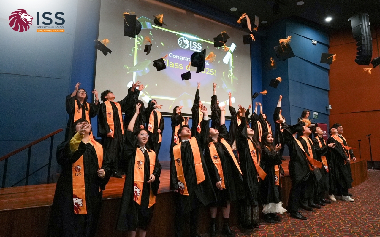 Graduates joyfully tossing their caps into the air, celebrating their academic achievements at a graduation ceremony