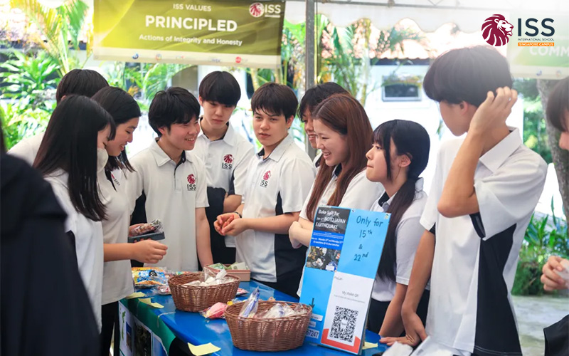 ISS students demonstrating principled leadership at a school community event.