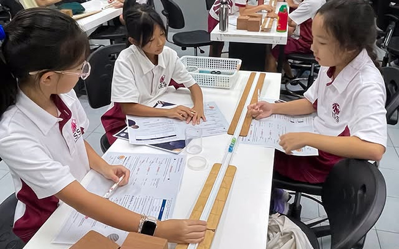 Students working together on a collaborative science experiment.
