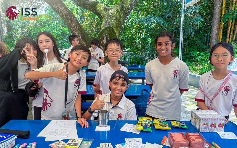 Diverse international school students smiling at an outdoor event